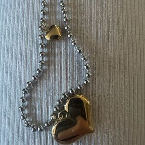Two beaded two tone heart pendants adjustable